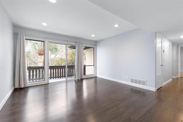 unfurnished room featuring dark hardwood / wood-style flooring