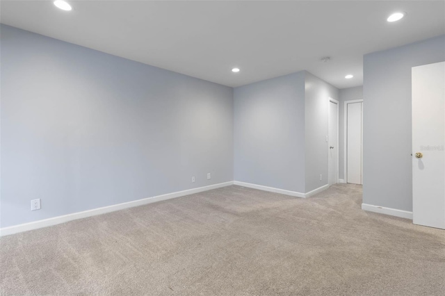 empty room featuring light carpet