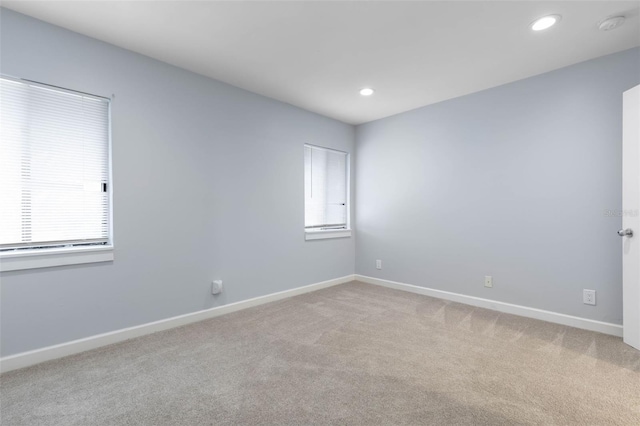 unfurnished room featuring carpet floors