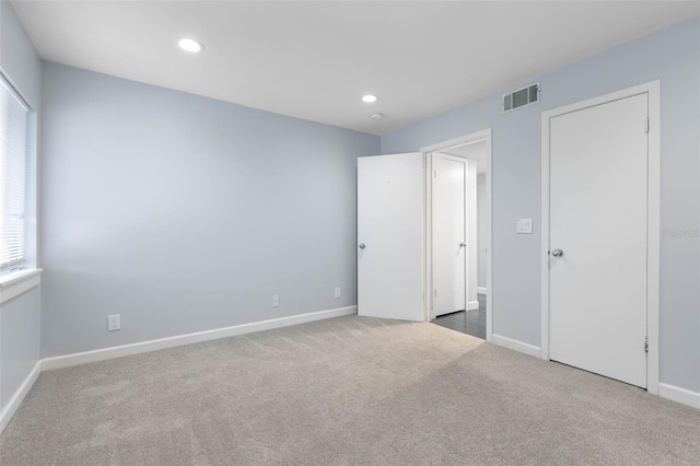 unfurnished bedroom with carpet floors