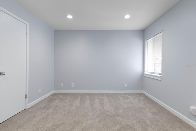 empty room with light colored carpet