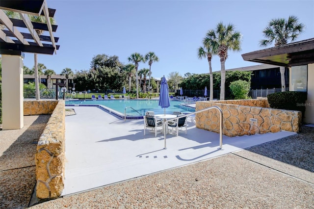 view of swimming pool with a patio area