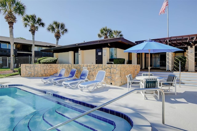 view of swimming pool with a patio area