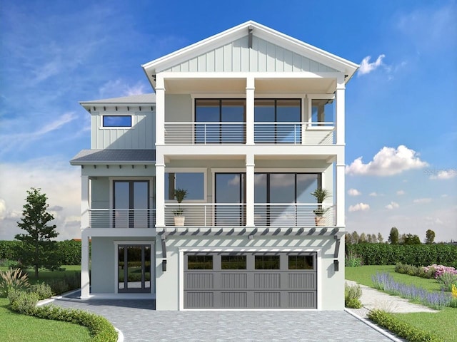 view of front of property with a garage and french doors