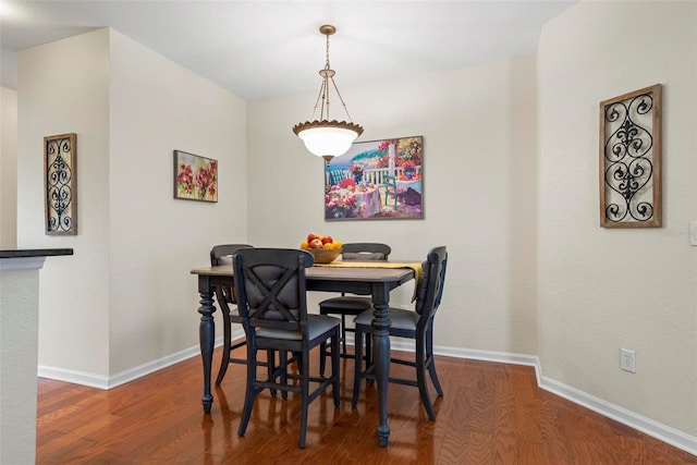 dining room featuring wood-type flooring