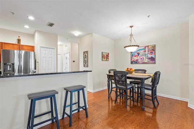 dining space featuring hardwood / wood-style floors