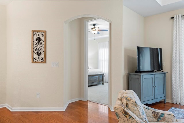 interior space with hardwood / wood-style floors and ceiling fan