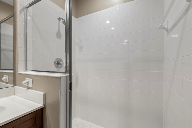 bathroom with vanity and an enclosed shower