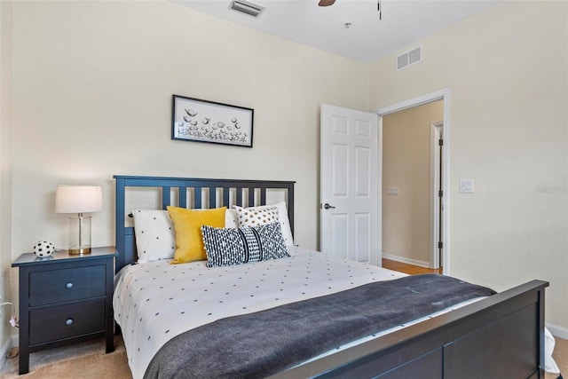 bedroom with ceiling fan and light colored carpet