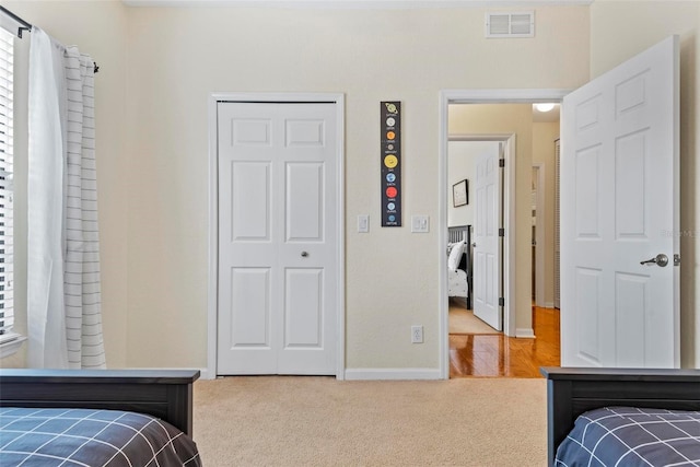 bedroom with carpet and a closet