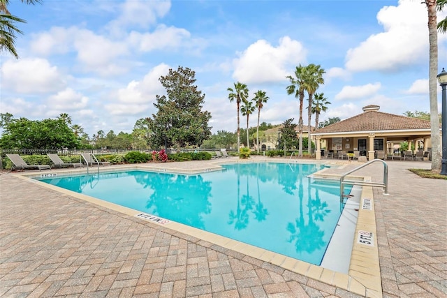 view of swimming pool featuring a patio area