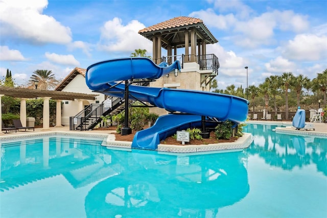 view of swimming pool featuring a water slide