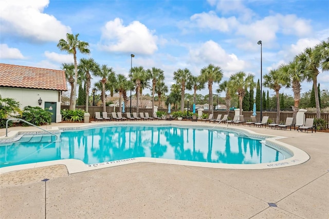 view of swimming pool featuring a patio area