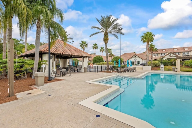 view of swimming pool with a gazebo and a patio area