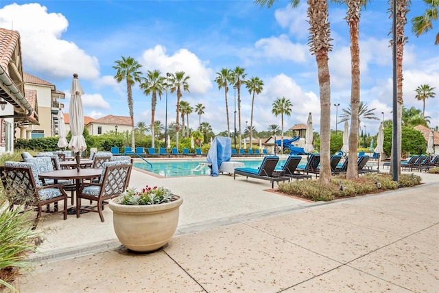 view of swimming pool with a patio