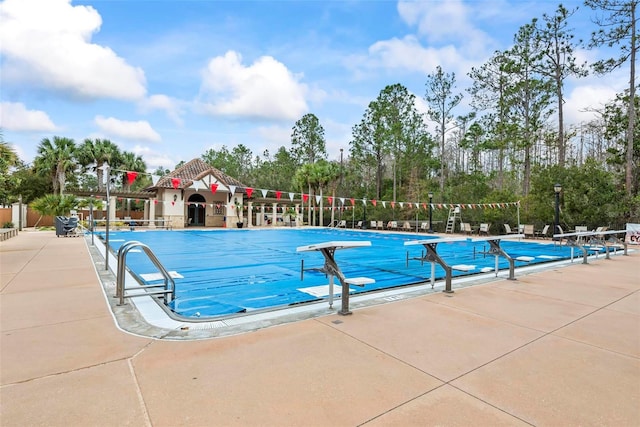 view of swimming pool featuring a patio