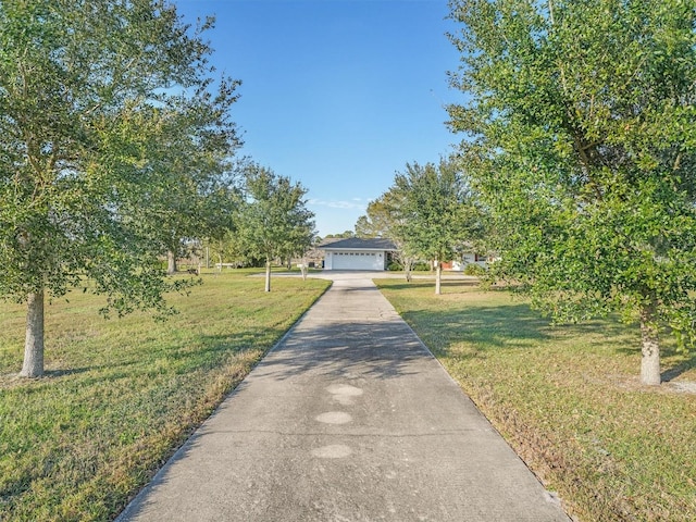 view of front of house featuring a front yard and a garage