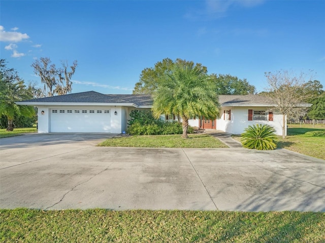 ranch-style house with a front lawn and a garage