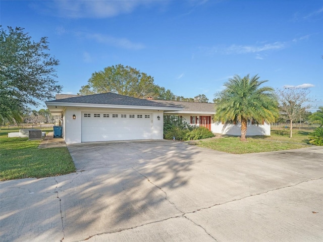 view of front facade featuring a garage and a front lawn