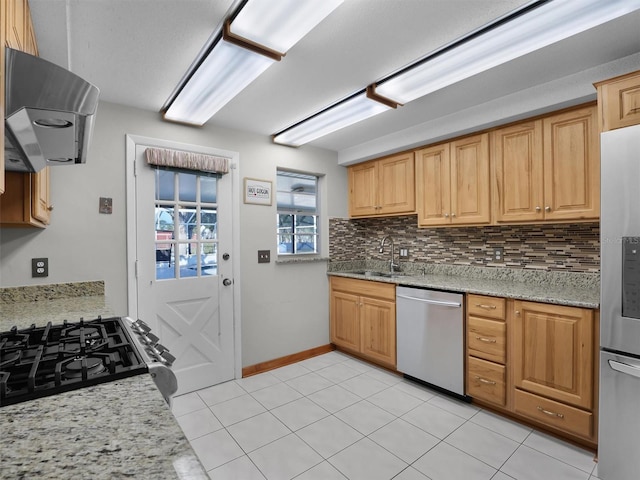 kitchen with decorative backsplash, stainless steel appliances, sink, exhaust hood, and light tile patterned floors