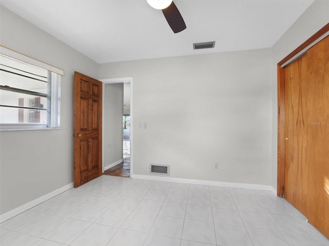 unfurnished bedroom with a closet and ceiling fan