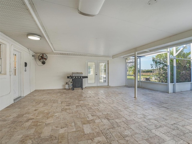 unfurnished sunroom with french doors