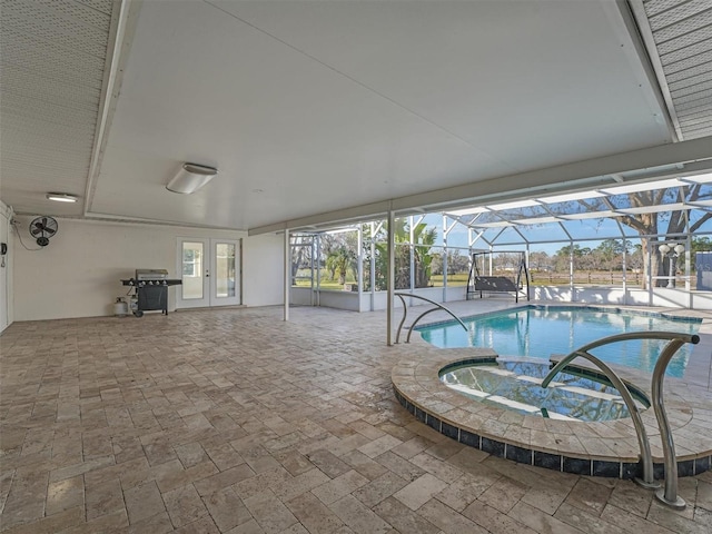 view of pool with an in ground hot tub, a patio area, grilling area, and a lanai