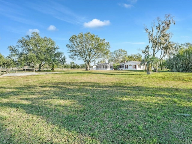 view of yard with a rural view