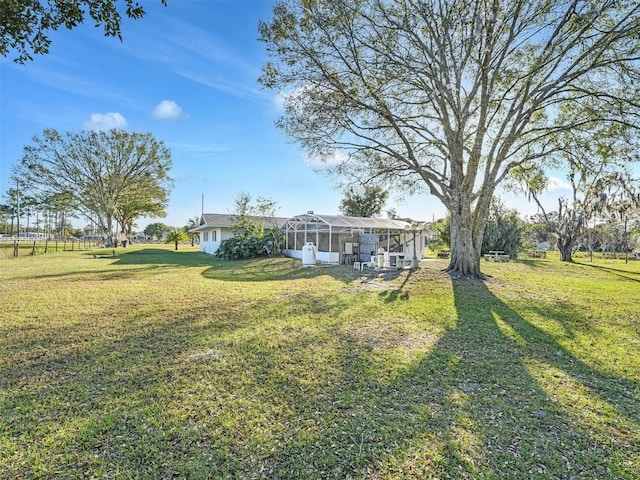 view of yard featuring a lanai