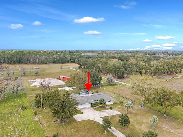 birds eye view of property featuring a rural view