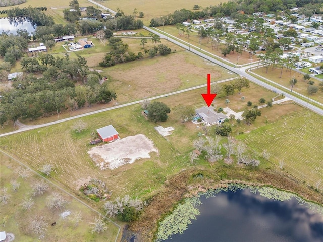 bird's eye view featuring a water view and a rural view