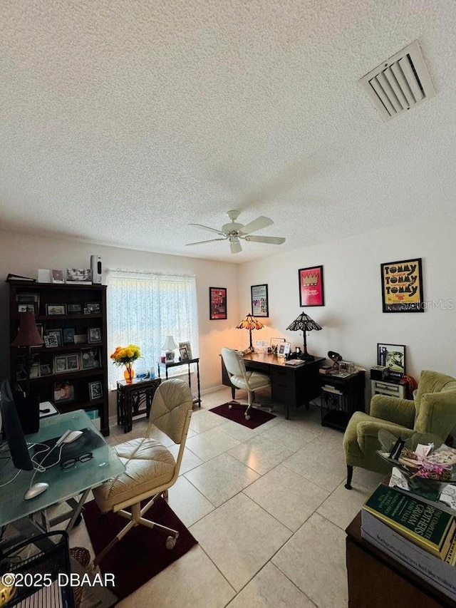 living room with light tile patterned floors, a textured ceiling, and ceiling fan