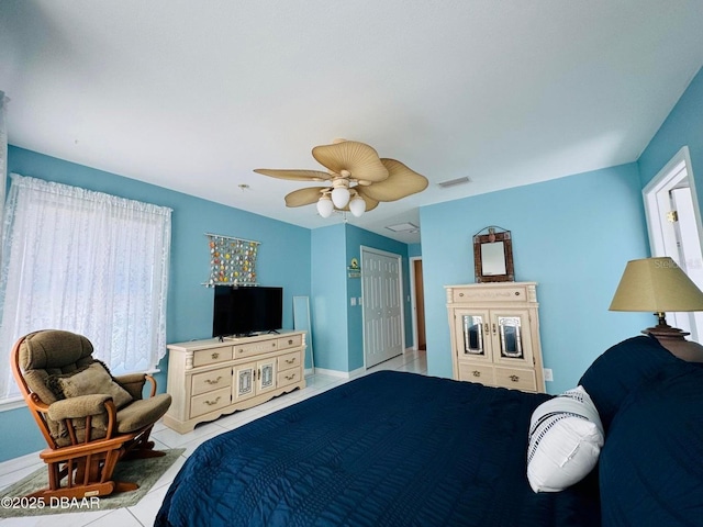 bedroom featuring ceiling fan and light tile patterned flooring