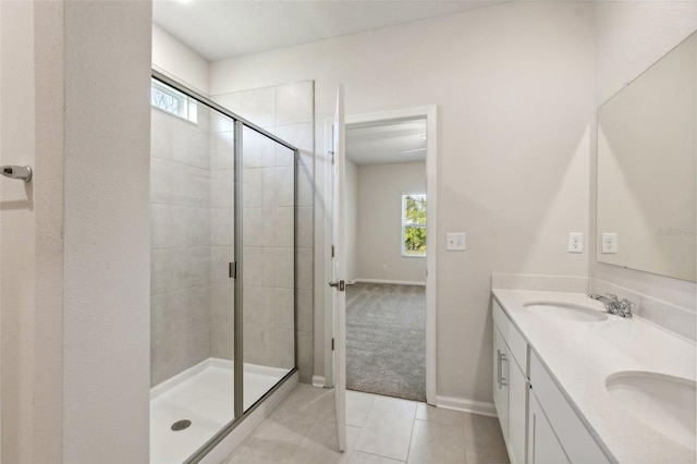 bathroom featuring vanity, tile patterned floors, and an enclosed shower