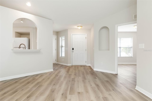 entrance foyer featuring light hardwood / wood-style flooring