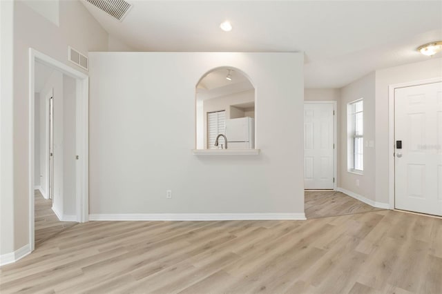 entrance foyer featuring light hardwood / wood-style floors