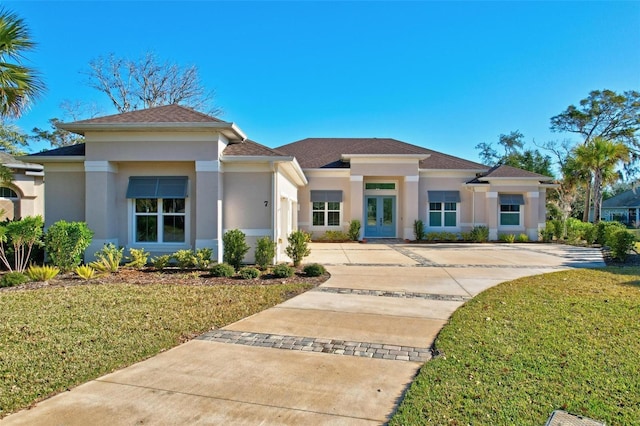 prairie-style house with a front yard