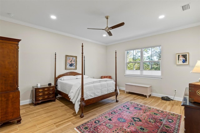 bedroom with ceiling fan, light hardwood / wood-style floors, and ornamental molding