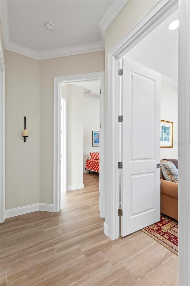 hallway featuring crown molding