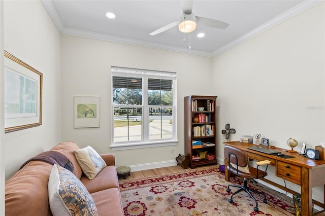 office space with ornamental molding, ceiling fan, and light hardwood / wood-style flooring