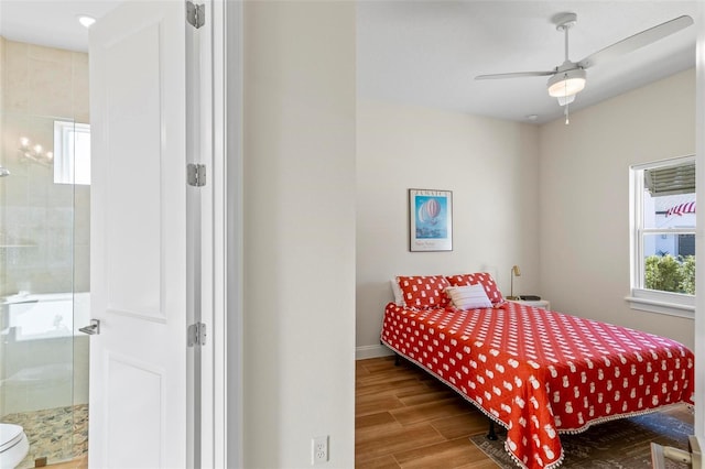 bedroom with ensuite bath and ceiling fan