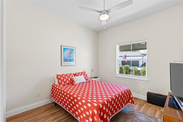 bedroom featuring ceiling fan and hardwood / wood-style flooring