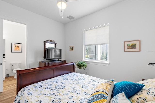 bedroom with ceiling fan and light hardwood / wood-style flooring