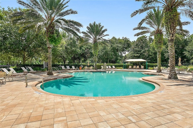 view of swimming pool featuring a patio area