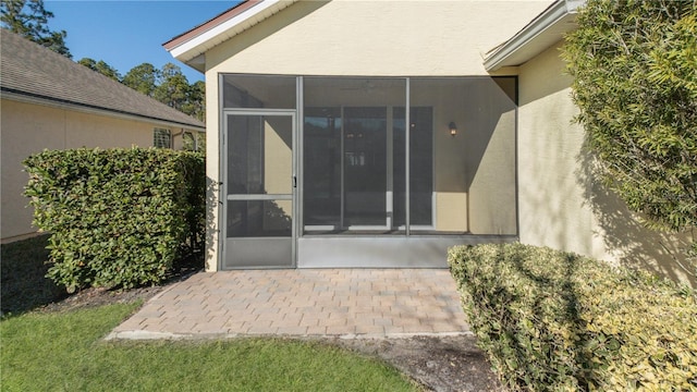 property entrance featuring a patio