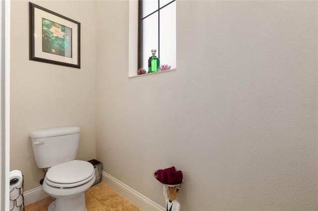 bathroom featuring toilet and tile patterned floors