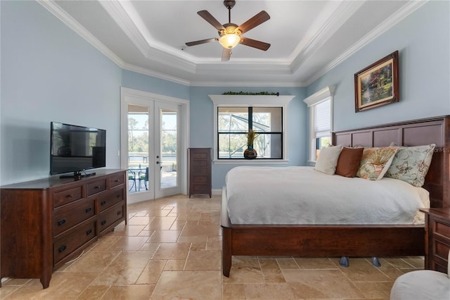 bedroom featuring ceiling fan, a raised ceiling, access to outside, ornamental molding, and french doors