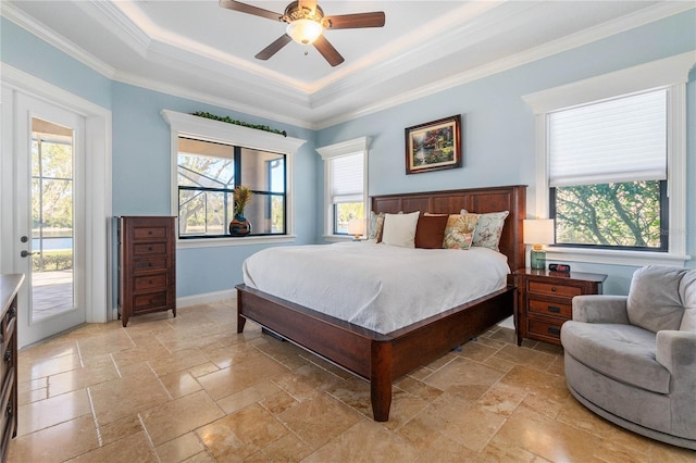 bedroom featuring ceiling fan, access to exterior, multiple windows, and a raised ceiling