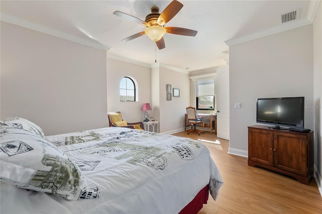 bedroom with ceiling fan, multiple windows, crown molding, and light wood-type flooring