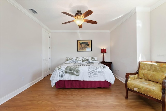 bedroom with ceiling fan, light hardwood / wood-style flooring, and crown molding